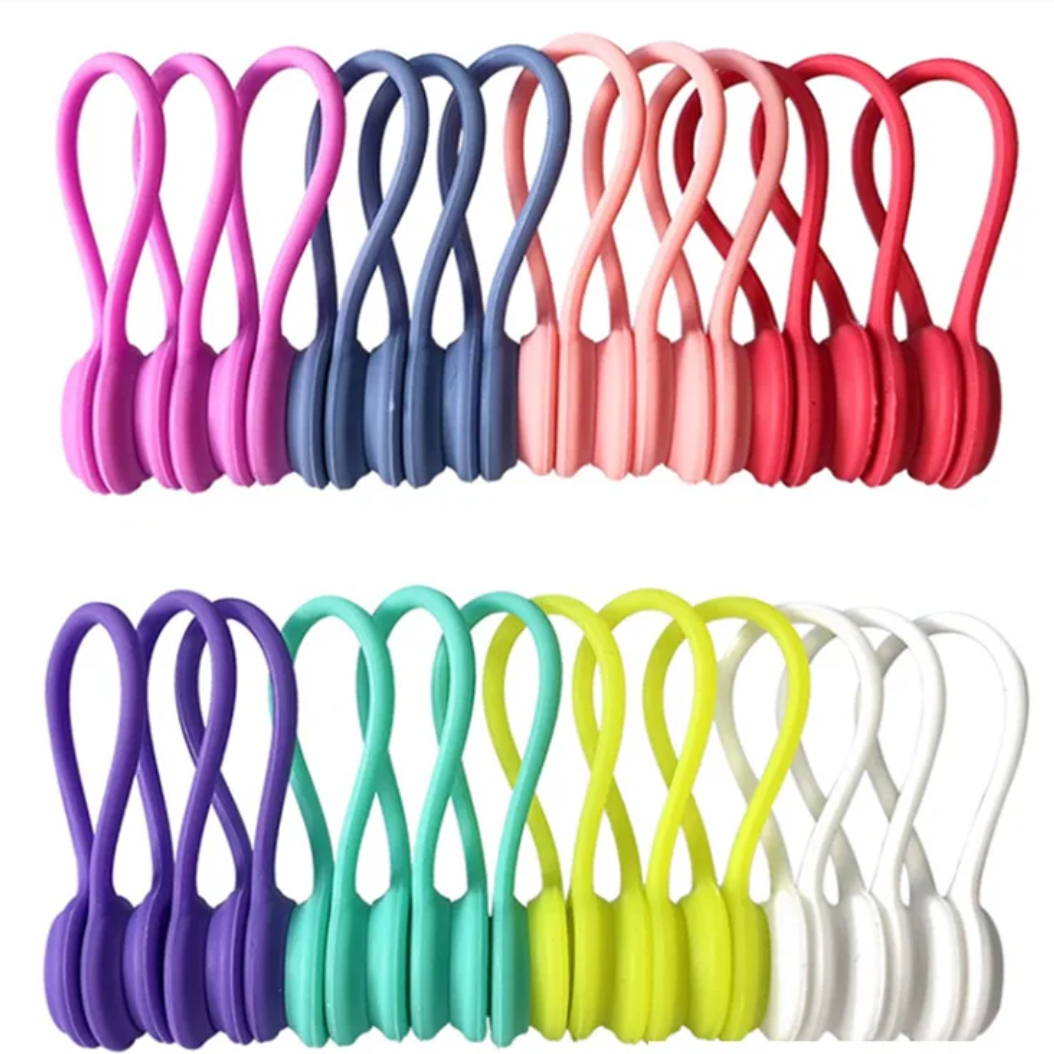 Set of colorful plastic hooks in various colors on a white background